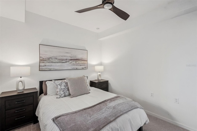 bedroom with ceiling fan, baseboards, and carpet