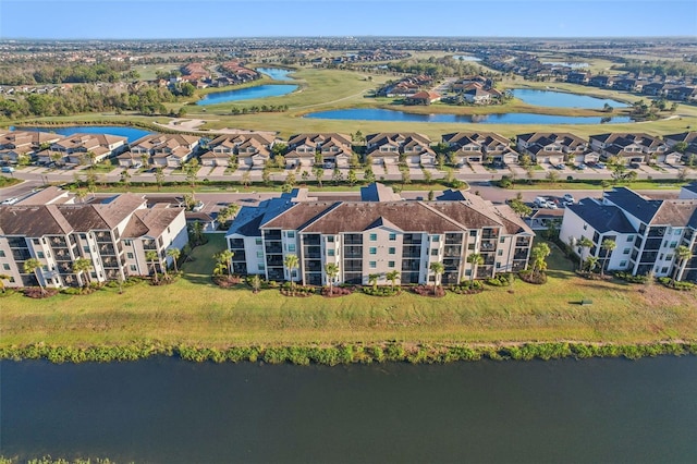 aerial view with a residential view and a water view