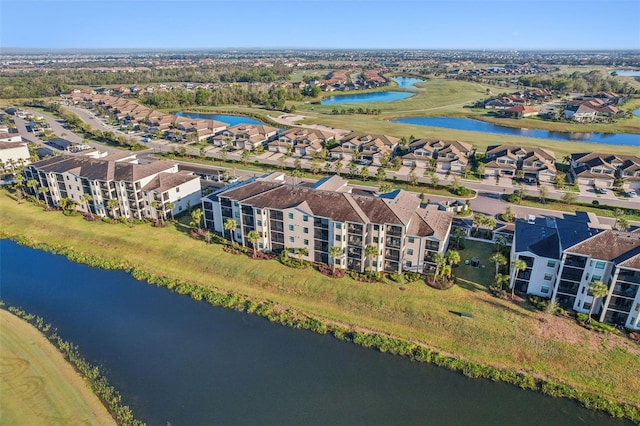 bird's eye view with a residential view and a water view