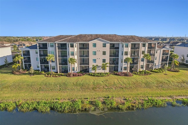 view of building exterior featuring a water view