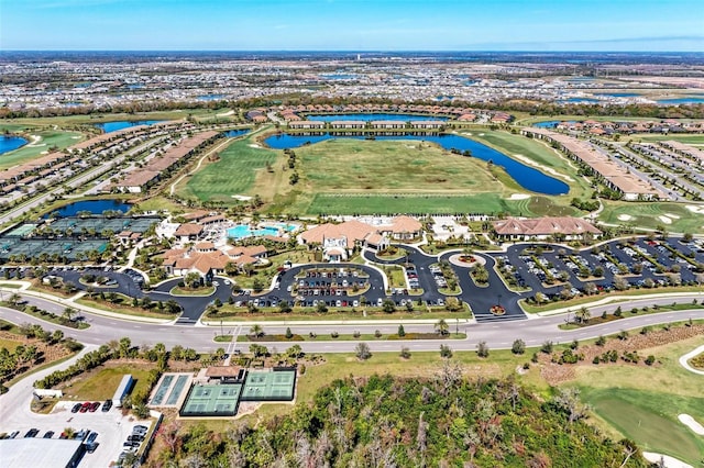 aerial view featuring view of golf course and a water view