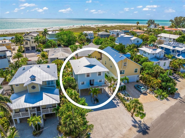 drone / aerial view featuring a water view and a residential view