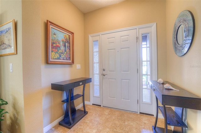 entryway featuring baseboards