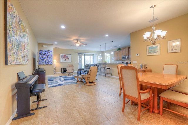 dining area featuring visible vents, baseboards, light tile patterned floors, ceiling fan with notable chandelier, and recessed lighting