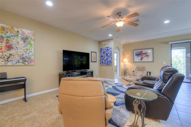 living area featuring recessed lighting, baseboards, light tile patterned flooring, and a ceiling fan