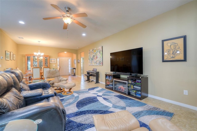 living room featuring arched walkways, tile patterned flooring, ceiling fan with notable chandelier, and baseboards