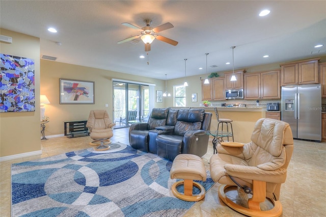 living area with light tile patterned floors, visible vents, baseboards, recessed lighting, and ceiling fan