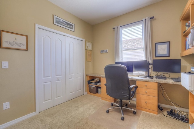 home office featuring carpet flooring and baseboards