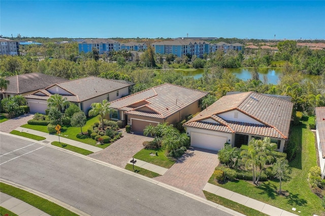 bird's eye view featuring a residential view and a water view