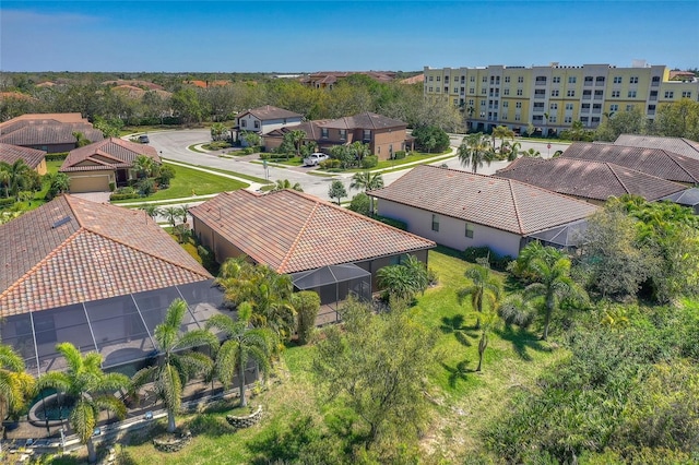 birds eye view of property with a residential view