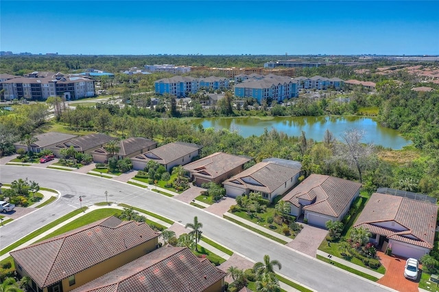 bird's eye view featuring a residential view and a water view