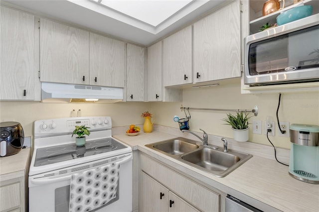 kitchen with stainless steel microwave, under cabinet range hood, light countertops, white electric range, and a sink