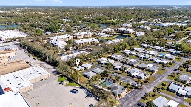 drone / aerial view with a residential view and a water view