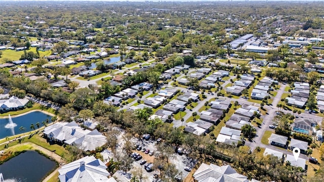 bird's eye view with a residential view and a water view