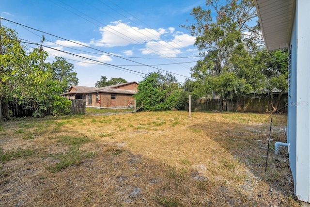 view of yard featuring fence