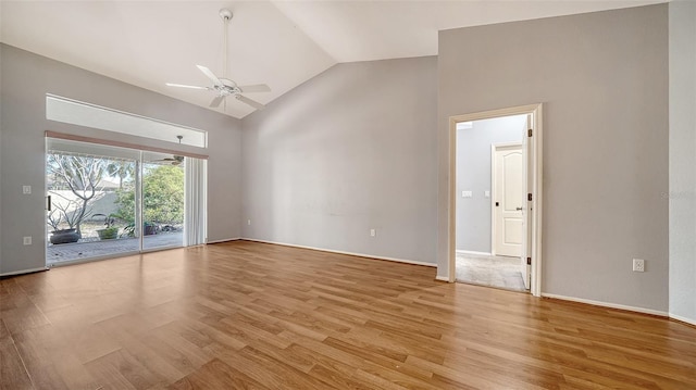 spare room with high vaulted ceiling, light wood-style floors, and a ceiling fan