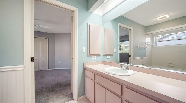 bathroom featuring vanity, visible vents, and ceiling fan