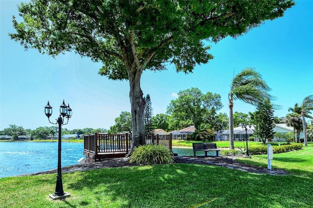 view of home's community featuring a yard and a water view