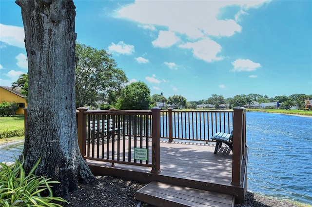 view of dock featuring a deck with water view