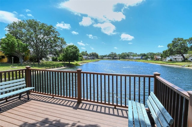 wooden deck with a water view