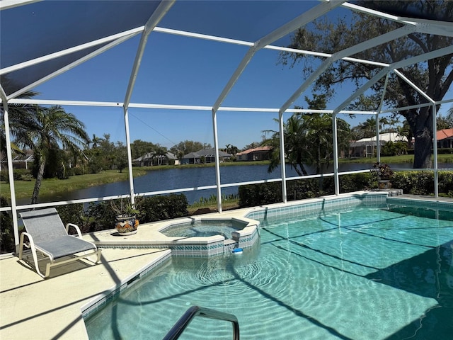 view of pool with a water view, a pool with connected hot tub, a lanai, and a patio area