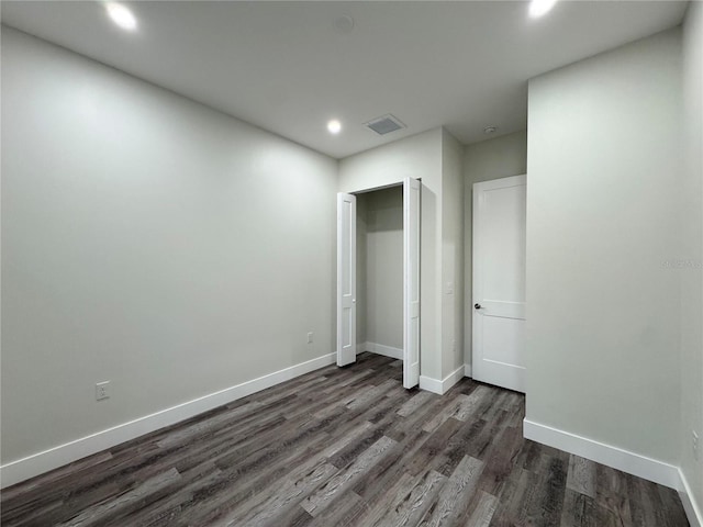 unfurnished bedroom with dark wood finished floors, recessed lighting, visible vents, and baseboards