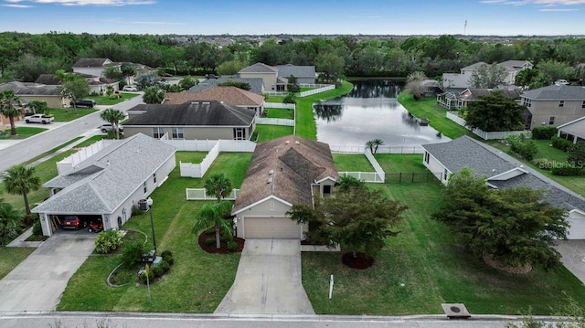 bird's eye view with a residential view and a water view