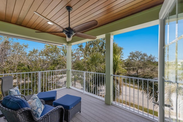 wooden deck featuring ceiling fan