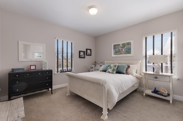 bedroom with baseboards and carpet floors