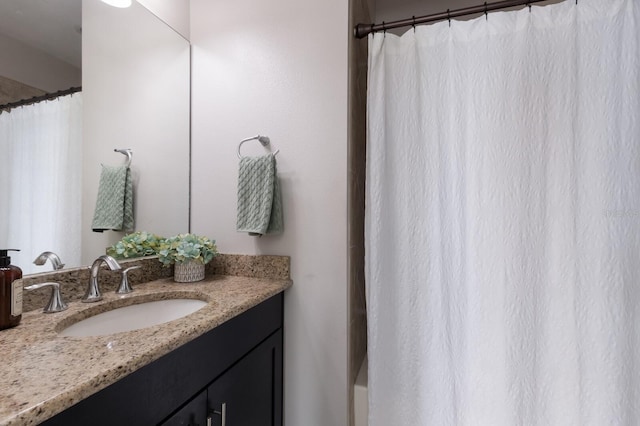 full bath featuring vanity and a shower with curtain