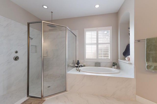 full bath featuring recessed lighting, a marble finish shower, and a garden tub