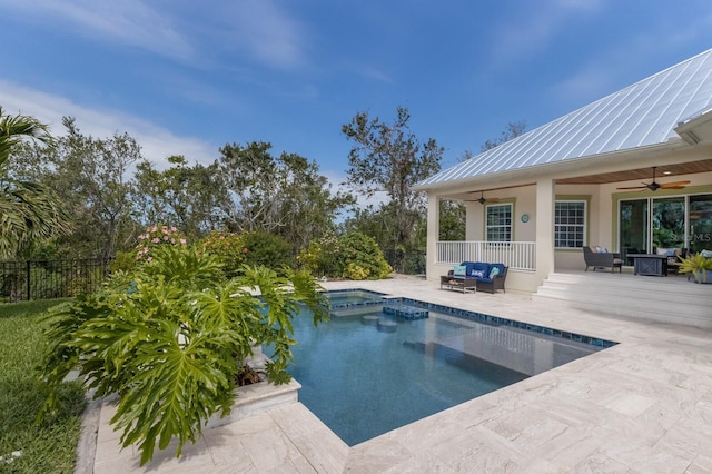 view of swimming pool with a fenced in pool, ceiling fan, fence, outdoor lounge area, and a patio