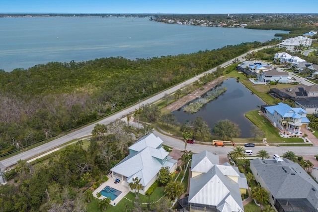 birds eye view of property featuring a water view and a residential view