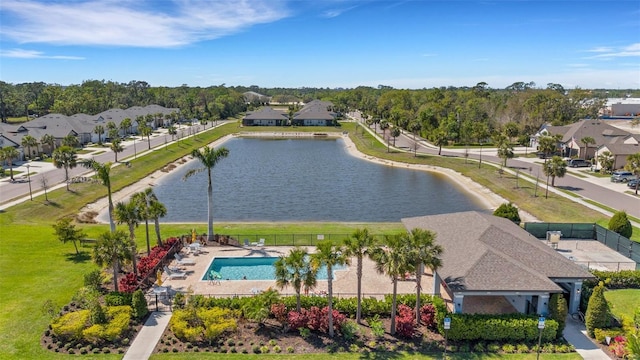 drone / aerial view with a residential view and a water view