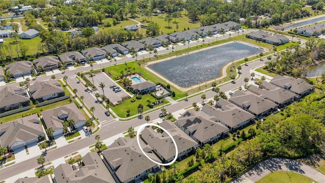 bird's eye view with a residential view and a water view