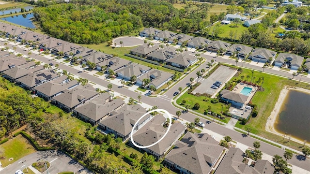 birds eye view of property featuring a residential view and a water view