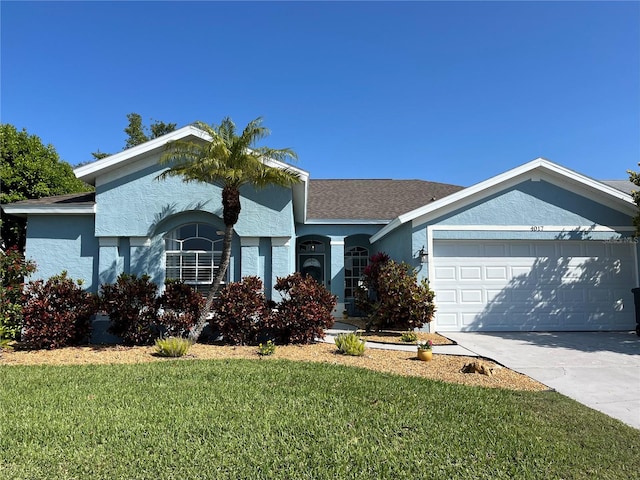 ranch-style home featuring stucco siding, driveway, a front lawn, roof with shingles, and a garage