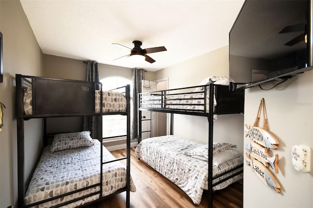 bedroom featuring ceiling fan and wood finished floors