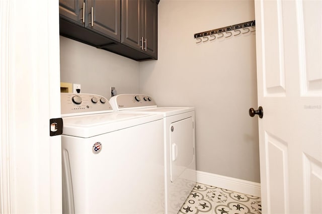 laundry room with baseboards, cabinet space, tile patterned flooring, and washer and clothes dryer