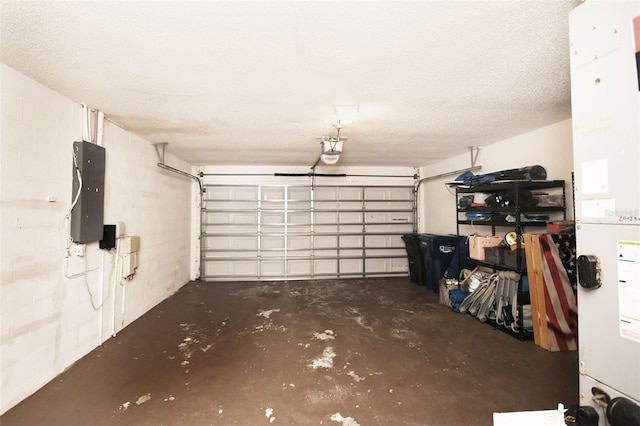 garage with electric panel, concrete block wall, and a garage door opener