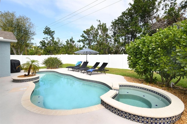 view of pool with a patio, a fenced backyard, and a pool with connected hot tub