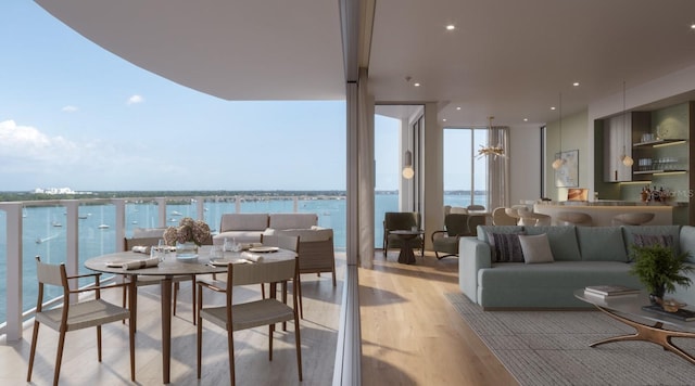 balcony with outdoor lounge area and a water view