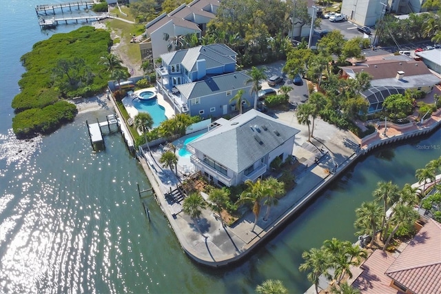 drone / aerial view featuring a water view and a residential view