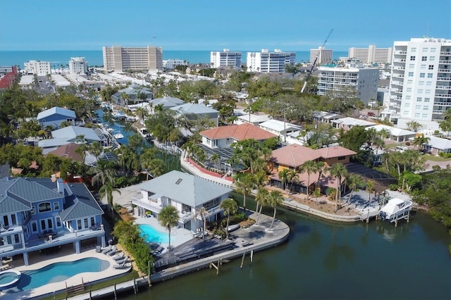 drone / aerial view with a view of city and a water view