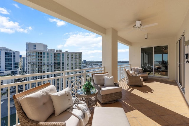 35 Watergate Dr Unit 1402, Sarasota, FL 34236 - balcony with an outdoor living space, a city view, and ceiling fan