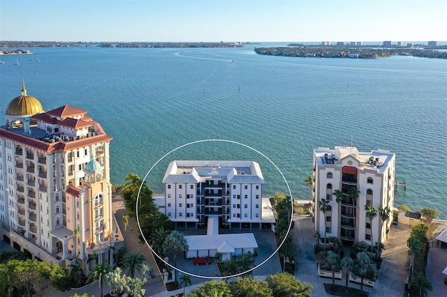 birds eye view of property featuring a water view