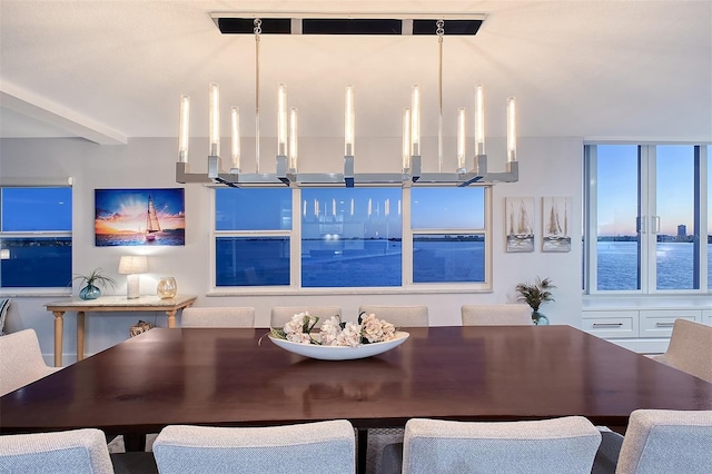 dining area with beam ceiling