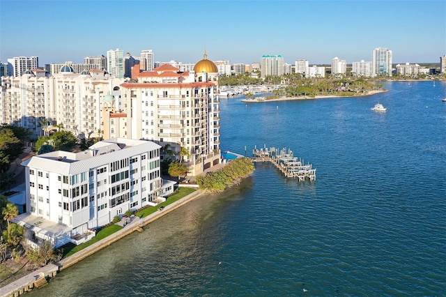 exterior space featuring a water view and a city view