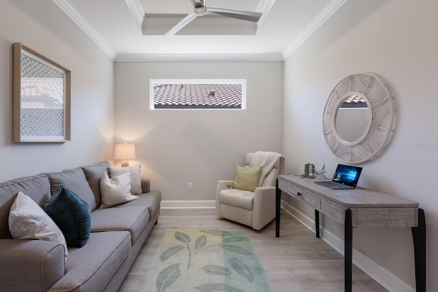 living room with ceiling fan, baseboards, light wood finished floors, and ornamental molding