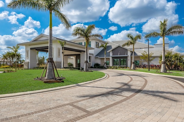 view of property featuring curved driveway